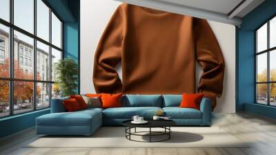 Brown color crew-neck sweatshirt lying flat and folded on top of a white background Wall mural