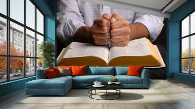 holy bible open with a cross on a hand Wall mural