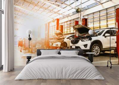 car in automobile repair service center with soft-focus and over light in the background Wall mural