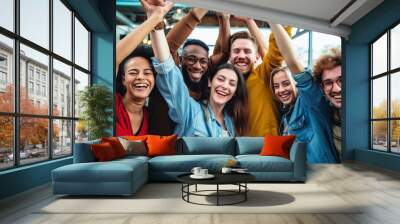 Group of multiracial people with hands up smiling at camera together - Corporate team colleagues congratulating coworker with business success in coworking shared, Generative AI Wall mural