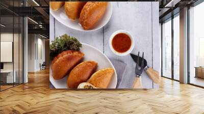 Panada is a fried bread filled with spicy tuna, a traditional snack from Manado, Indonesia. Wall mural