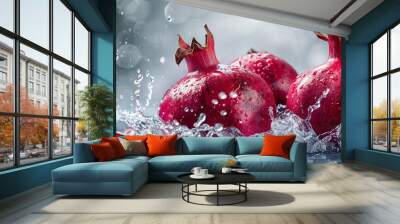 Pomegranate fruit and water splash. captured with highspeed photography as they break through the waters surface. Wall mural