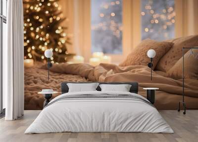 Beautiful Christmas tree with lights and blanket on bed Wall mural