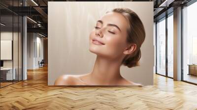 Beautiful woman with clean skin enjoys her beauty routine. Skin care, cosmetics and spa concept. Wall mural