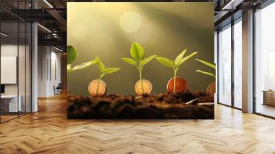 Green seedling growing from pile of coins on blurred background, business idea Wall mural