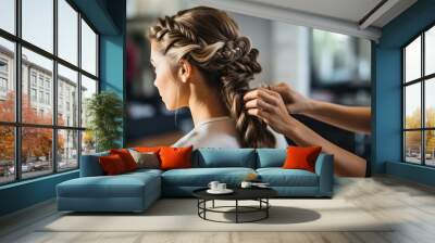 hairdresser braiding hair of woman in beauty salon Wall mural