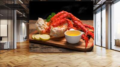 Cooked Organic Alaskan King Crab Legs with Butter and lemons, Alaskan King Crab on vintage wooden background. Wall mural