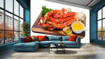 Cooked Organic Alaskan King Crab Legs with Butter and lemons, Alaskan King Crab on wood plate in white background. Wall mural