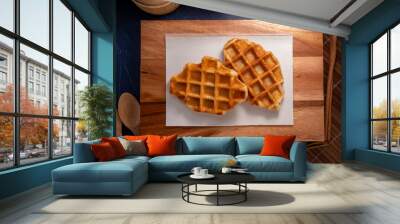 Delicious Waffle and Croissants in wooden plate on wooden table, Freshly baked croissants and Waffle on brown wooden table. Wall mural