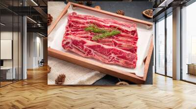 Raw Cross Cut Short Ribs beef on wooden plate, Beef Short Ribs (Sliced) on wooden background. Wall mural