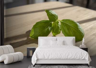 Basil leaves isolated on cutting board Wall mural