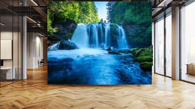 ai generative of blue ink of the waterfall in summer forest with nature background Wall mural