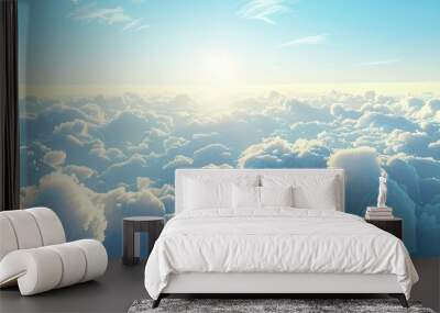 A scenic view of the sky at sunrise with fluffy white clouds and a vast expanse of blue perfect for a copy space image Wall mural