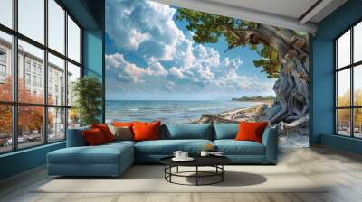 An ancient tree trunk stands tall along the sandy coastline with the sea in the background creating a picturesque scene with copy space image Wall mural