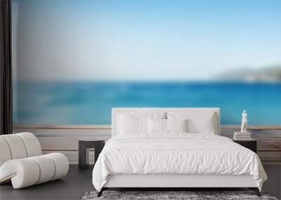 Product placement potential on a blue wooden board with a blurred sparkling sea in the background, perfect for a summer holiday concept with copy space image. Wall mural