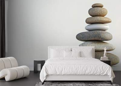 River rocks delicately balanced with copy space image on a white background Wall mural