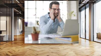 Desperate businessman working on his desk Wall mural