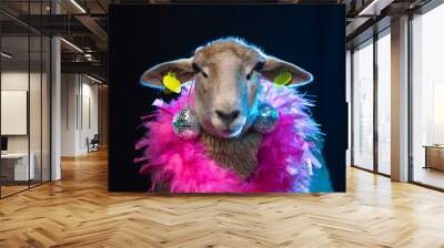 Close-up portrait of sheep with disco ball earring and neon boa. Wall mural