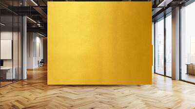 Gold wall texture background. Yellow shiny gold foil paint on wall sheet with gloss light reflection, Wall mural