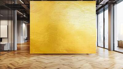 Gold wall texture background. Yellow shiny gold foil paint on wall surface with light reflection Wall mural