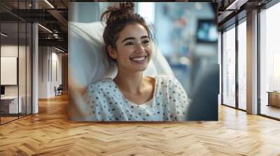 Young female patient smiling in hospital bed during recovery Wall mural