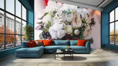 Christmas bridal bouquet. A beautiful bouquet of white flowers, cotton, and fir branches Wall mural