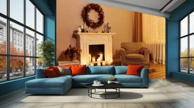 ireplace with candles, cozy armchair, autumn wreath on the wall Wall mural