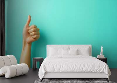 Closeup of hand showing thumbs up sign isolated on turquoise background. Copy space for ad text. Wall mural