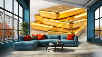 A stack of shiny gold bars arranged neatly on a surface. Wall mural