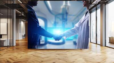 Engineers shaking hands in a futuristic lab. Wide image for banners, advertisements. Wall mural