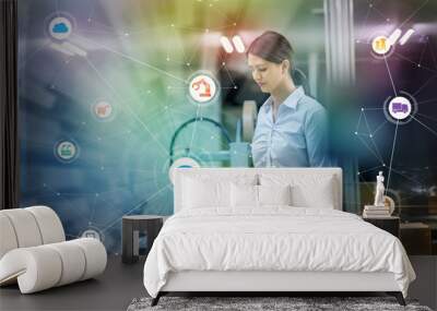 industry and internet of things concept. woman working in factory and wireless communication network Wall mural