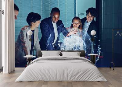 Multi racial group watching hologram of the earth in dark office. Global network. Wall mural