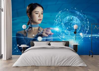 Young woman watching holographic globe. Global communication network concept. Wall mural