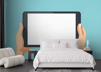 Hands holding a tablet with an empty screen Wall mural