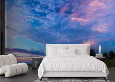 Warm summer sunset over fields and meadows Wall mural