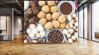 Assortment of multicolored artisan pastries, biscuits, cookies, and sweetcakes tastefully displayed at the local pastry shop Wall mural