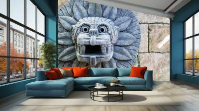 animal head made of stone on the wall in the style of South American Indians Wall mural