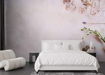 Herbs and dried flowers on pastel pink backdrop. Copy space. Romantic floral background. Wall mural