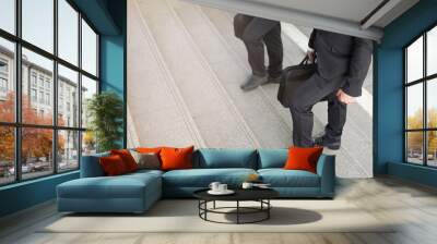 Businessman two people walking upstairs ,Fighting against obstacles Climb up to Successful finish  we will walk together concept Wall mural