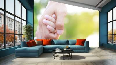 Children's hands with the warmth of mother's care Wall mural