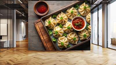 Tray of freshly cooked dumplings with dipping sauce Wall mural