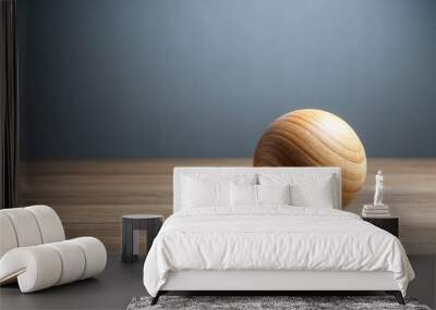 Wooden ball standing on table with leading lines on grey background Wall mural