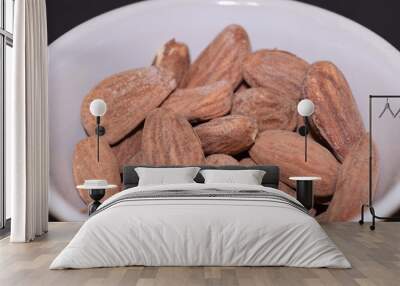 Salted and roasted almonds. Wall mural