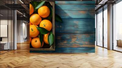 Oranges with leaves in an old box on a wooden table, orange with leaves, orange closeup, orange on a wooden table, orange, healthy food, healthy concept Wall mural