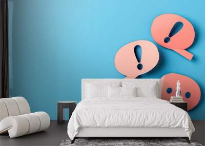 Two speech bubbles with exclamation and question symbols on a blue background. Wall mural