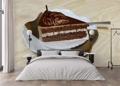 Fresh cream chocolate cake on wood table Wall mural