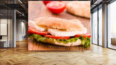 Puccia bread with mozzarella and tomato. Wall mural