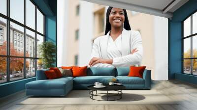 Arms crossed, happy vision and black woman with power, business and motivation for corporate success in the city of Portugal. Idea, smile and African employee with pride, professional and thinking Wall mural