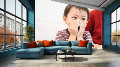 Asian toddler little boy covering face with both hands being afraid of watching scary movie.Confused timid child feeling shy hiding his emotions.Allergy, Sad, mask, no food, Bad breath, guilty, Repent Wall mural