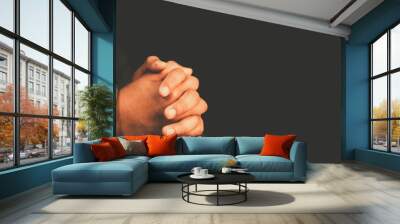 man praying worship at home on black background.Teenager hand praying,Hands folded in prayer.Good friday, Easter, forgiveness.Concept for faith, people, fasting and religion.stay home, lockdown. Wall mural